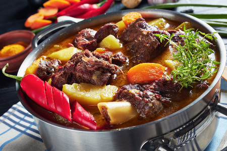 close-up of Jamaican Curried Goat – slow cooked Jamaican Spiced meat and veggies 