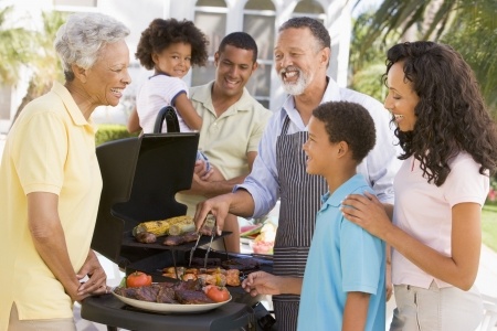 family enjoying a barbeque bbq